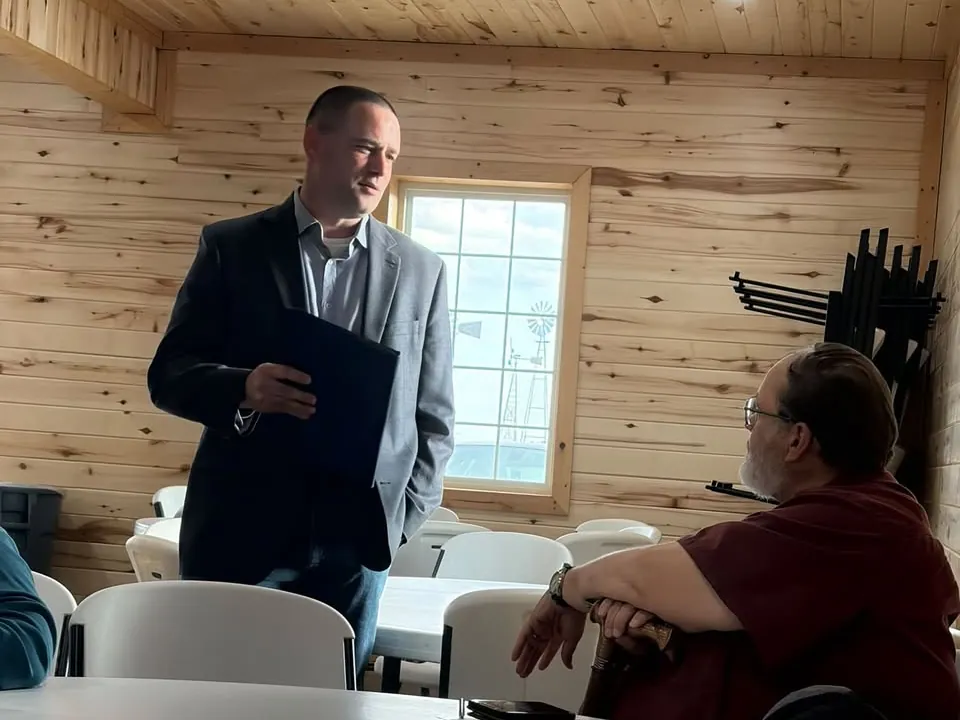 Sean Willcott talking with a community member at a Brown County Liberty Alliance gathering